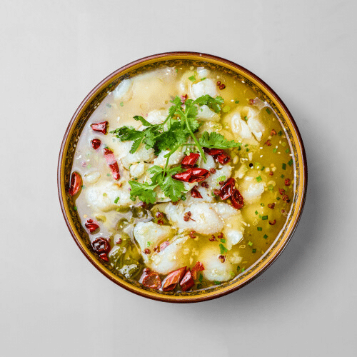 Zartgekochter Fisch in Sauerkraut Sauce nach Hausart (scharf)