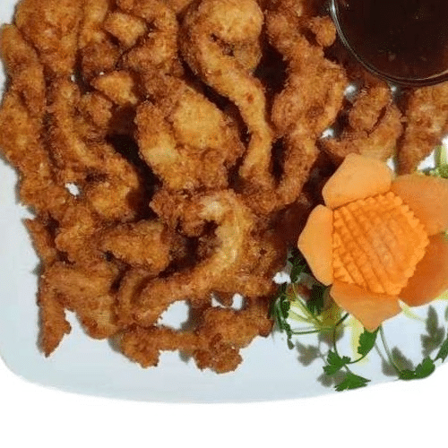 Panierte Hühnerfleischstreifen mit Süß-Sauer-Sauce