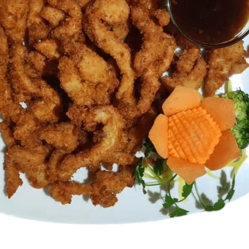 Panierte Hühnerfleischstreifen mit Süß-Sauer-Sauce