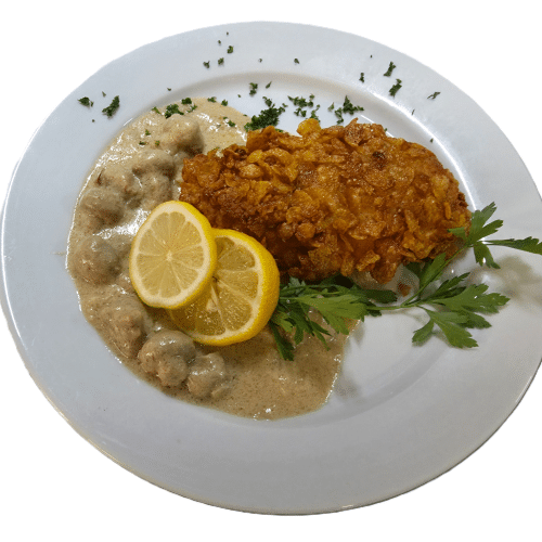 Schnitzel Hähnchen in Corn Flakes paniert aus der Pfanne
