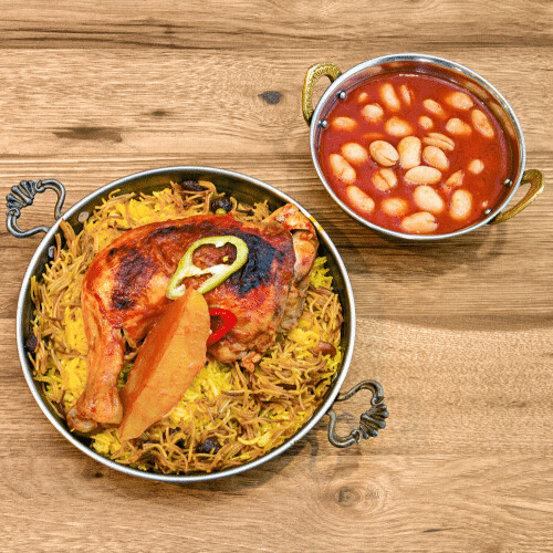 Reis Teller - Biryani mit Hähnchenkeule