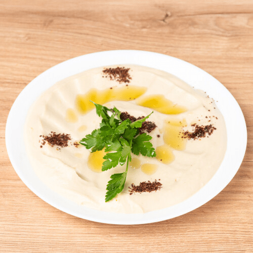 Hummus mit Olivenöl und Fladenbrot