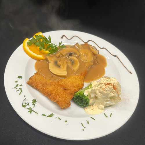 Putenschnitzel mit Rahm-Champignonsauce