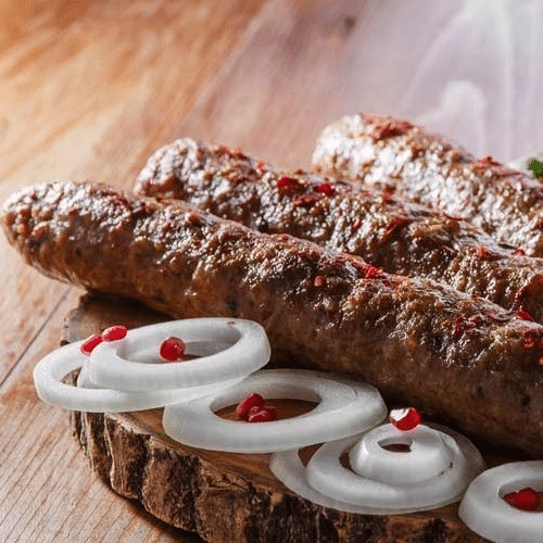Lula-kababi 1 stück (200) ,sauce,zwiebeln.