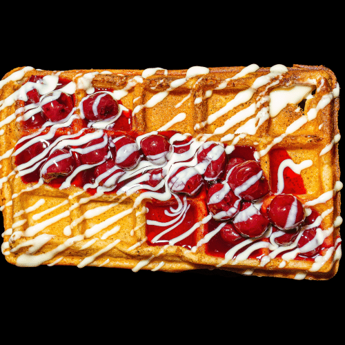 Waffel mit heißen Kirchen und Vanillesauce