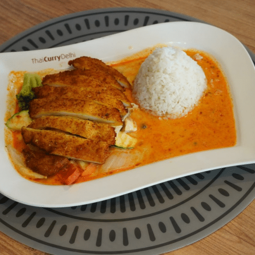 Gebackenes Hühnerfleisch mit einem Curry nach Wahl